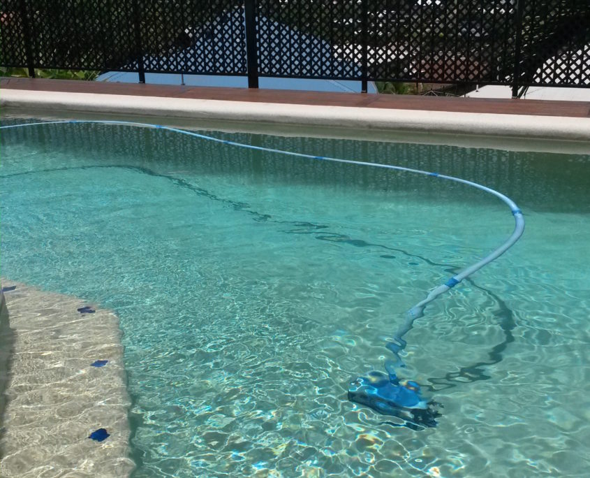 Robotic Pool Cleaner operates in the crystal clear water of a Konowna Cl Mooroobool swimming pool