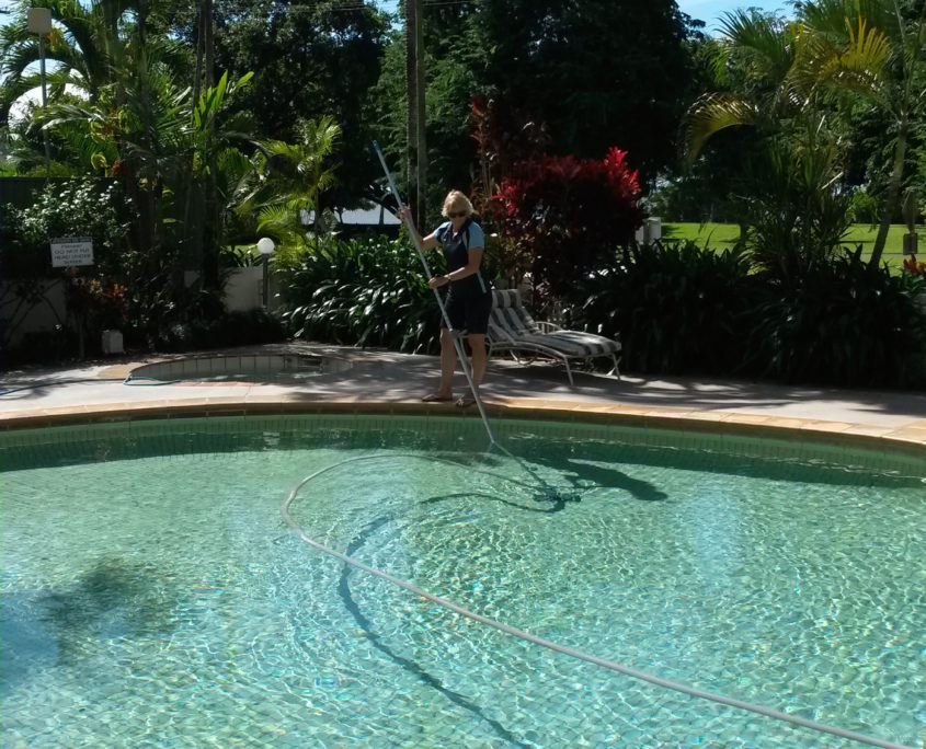Gretel vacuuming the 181 Apartments Cairns swimming pool