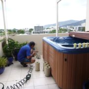 Cleaning spa filters at Accent apartment in Cairns